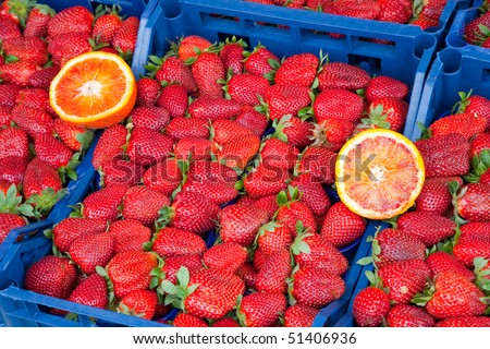 Organic strawberries lined up for sale at a market