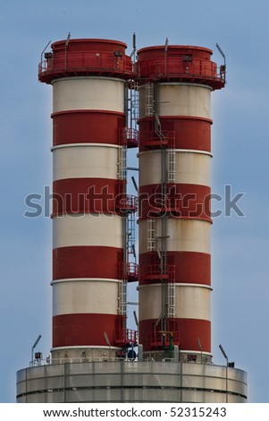 Couple of gas power station chimneys close-up
