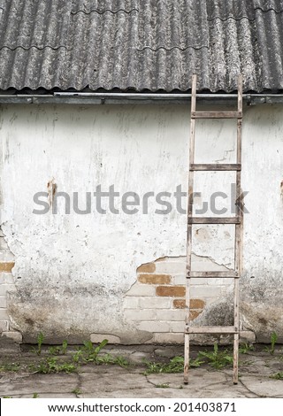 old, weathered brick wall, ladder near the wall background