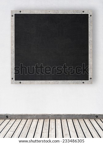 white stucco wall with chalkboard or menu board, wooden floor background
