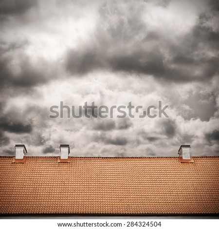 stormy sky and tiled roof top background