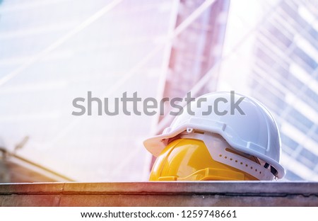 Safety helmet on the floor with building background