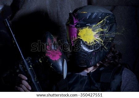 the photo as a paintball sphere is broken off at blow about a helmet