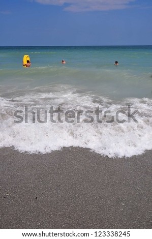 View of sand, surf and sky, perfect for cover art