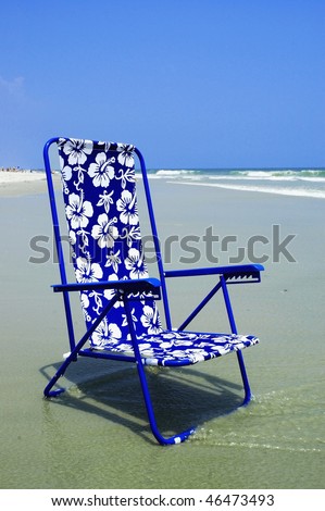 Pretty blue beach chair at surfs edge perfect for cover art