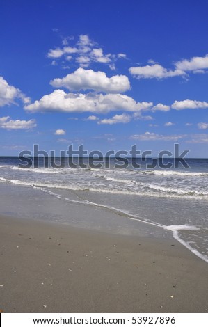 Beautiful view of ocean, sky and sand. Perfect for cover art or background.