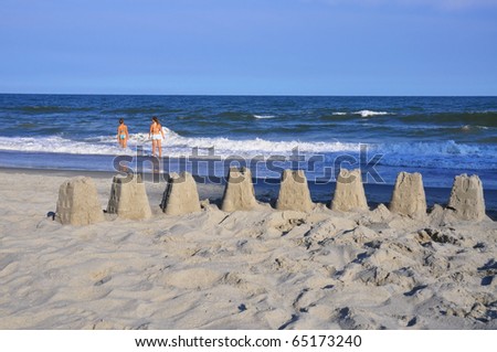 Beach scene with ocean and sandcastle