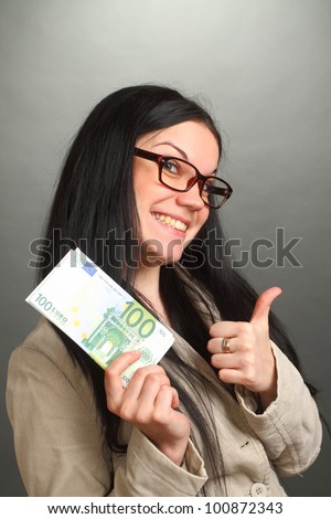 the girl the brunette wearing spectacles holds a roll of money