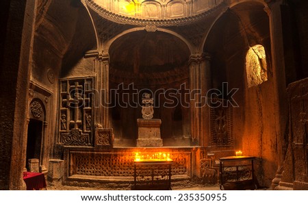 The big hall of the ancient Christian temple Geghard with a dome and columns The big hall of the ancient Christian temple Geghard with a dome and columns