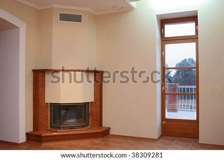 Empty room with a tiled floor, a fireplace and a door on a terrace