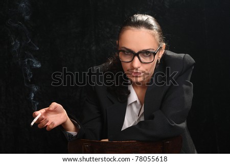 The woman in an image of the man, the transvestite with a cigaret and an impudent grin