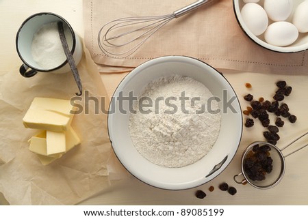 Ingredients for the pastry with raisins and kitchen utensils