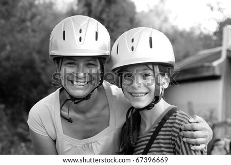 mother and daughter horseback riding