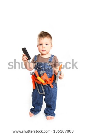 Little boy  with tools and mobile phone on a white background