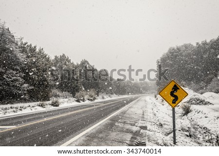 Yellow sing on the snow road