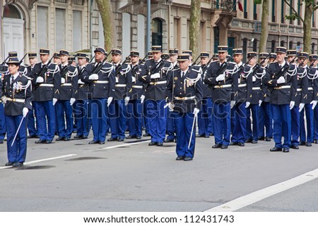LILLE, FRANCE - JULY 14: A local police unit lined up in formation at the start of a traditional Bastille Day parade through the city of Lille, France on July 14, 2012