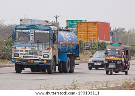 RAJASTHAN, INDIA - MARCH 26, 2014: Truck in traffic on the Jaipur to Delhi state highway. India has the second largest network of roads in the world and is reliant upon the movement of goods by road