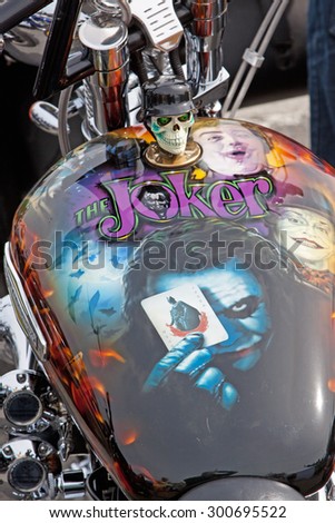 BIDEFORD, ENGLAND - MAY 30, 2015: The decorated motorcycle fuel tank on display at the town\'s Bike Show, held annually to support local charities. It attracts 2,000 bikes, many of which are customised