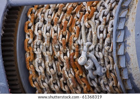 Old pulley and chain lifting gear on board a ship