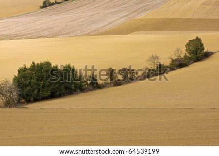 Gently rolling agricultural landscape in Gascony, France laid fallow at the end of the growing season