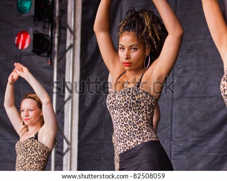 BRISTOL, ENGLAND - JULY 30: Contemporary dance troupe Cubania performing on the main stage in the Dance Village at the free three day Harbour Festival in Bristol, England on July 30, 2011.