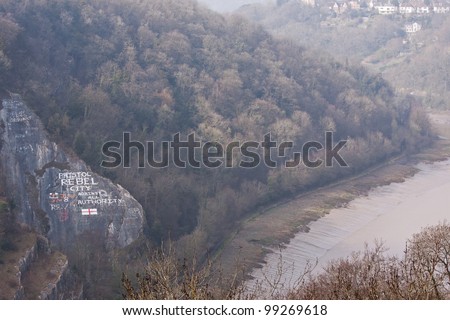 Graffiti on a rock face in the Avon Gorge on the outskirts of Bristol UK proclaiming the city\'s radicalism