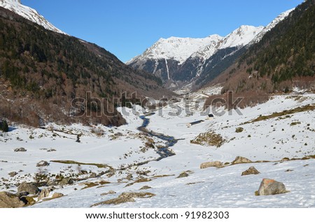 Winter Landscape of Osseu valley (vallee d\'Ossau) close to Col de Portalet,  mountain pass at Spanish border, Atlantic Pyrenees, Aquitaine, Bearn, France. snowy Pic de la Sagette is a
