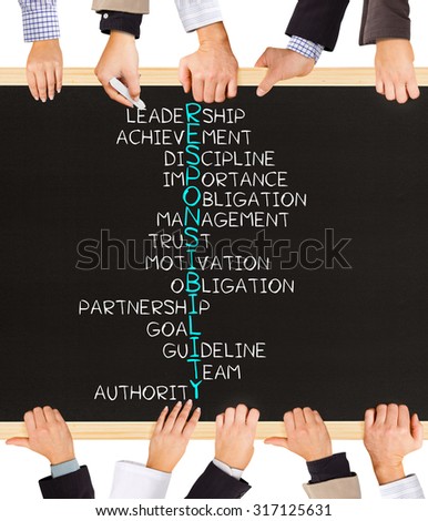 Photo of business hands holding blackboard and writing RESPONSIBILITY concept
