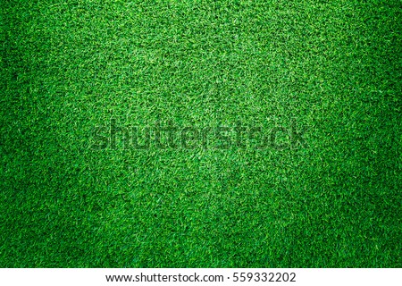 Green grass texture, grass background for design with copy space for text or image. Top view of artificial green grass for golf course and soccer field.