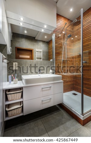 Elegant bathroom interior in white and grey colors