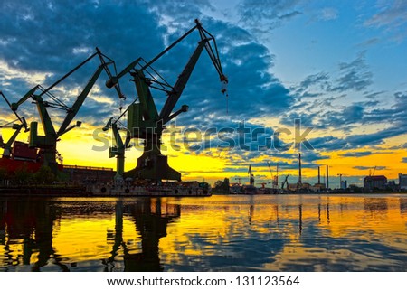 Monumental Cranes at sunset in Shipyard.