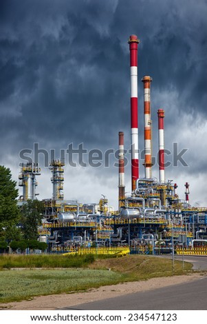 Oil industry refinery factory with dramatic sky.