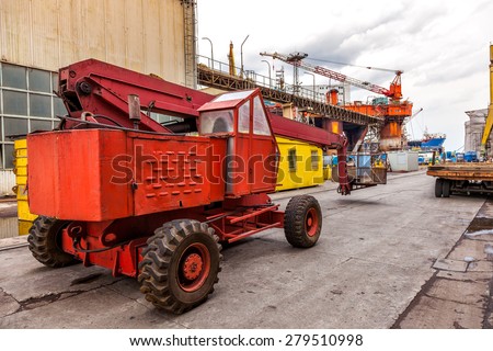 Industrial equipment - mobile crane basket in shipyard.