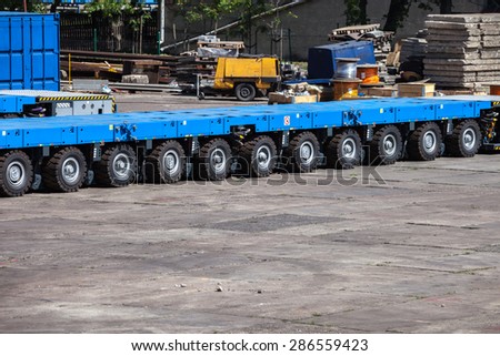 Heavy load transportation trailer with many platform.