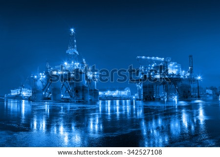 Oil Rig at night in Shipyard - industry concept.