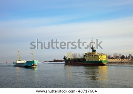 Two ships passing in the port channel.