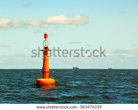 Navigation buoy at the edge of a fairway.