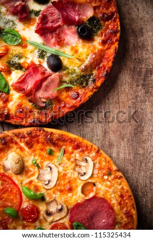 Tasty Italian pizza on wooden background