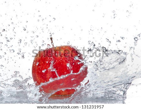Apple with water splash isolated on white
