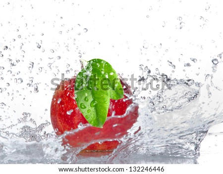 Apple with water splash isolated on white
