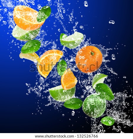 Tropical fruits in water splash