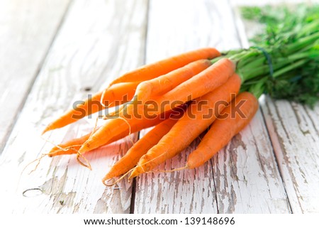 Fresh Carrots On Wooden Background