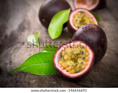 Passion Fruits On Wooden Background