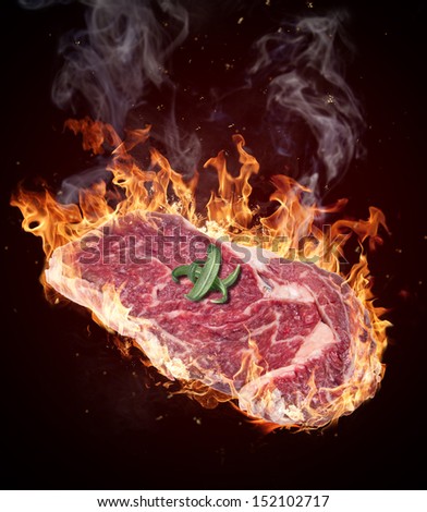 Premium Raw beef sirloin in fire flames