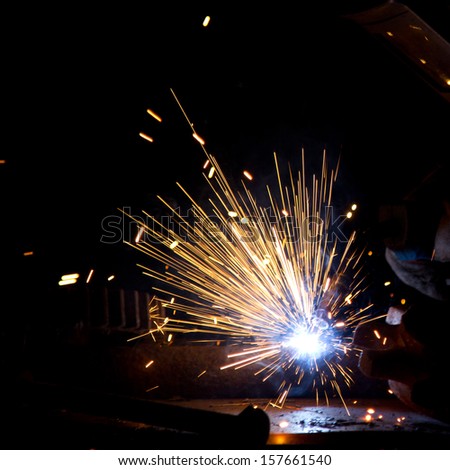 Sparks During Metal Cutting Over Black