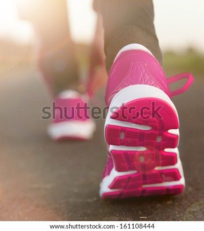 Runner Feet Running On Road. Shoe Close-Up.