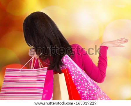Christmas Shopping. Happy Woman with Shopping Bags.