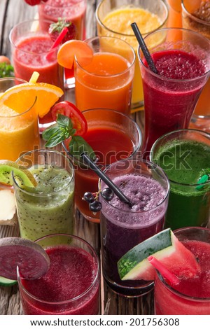 Fresh juice mix vegetables and fruit, healthy drinks on wooden table.