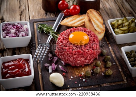 fresh beef tartar with egg, close-up.