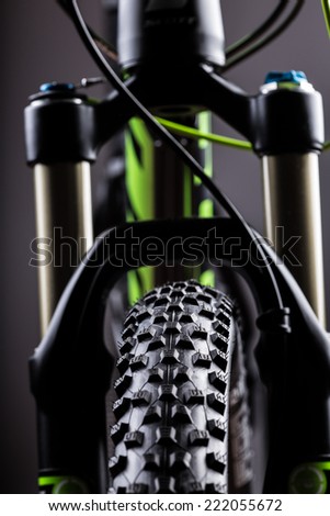 close-up of a mountain bike spring fork, studio shot.